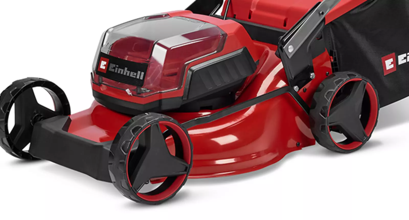 Акумуляторна газонокосарка Einhell з міцною червоною сталевою декою та чорним травозбірником, показана збоку, злегка нахилена спереду.